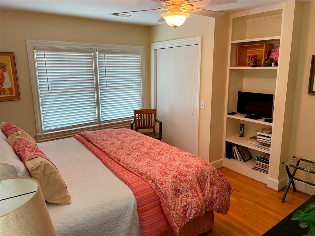 103 Poole Lane Clemson, SC 29631 - Photo 23 of 48 This inviting bedroom features built-in shelving, offering both comfort and practical storage.