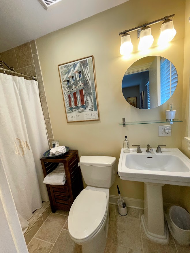 103 Poole Lane Clemson, SC 29631 - Photo 25 of 48 This bathroom is ensuite in second bedroom. A sleek design with a modern pedestal sink and walk in shower.