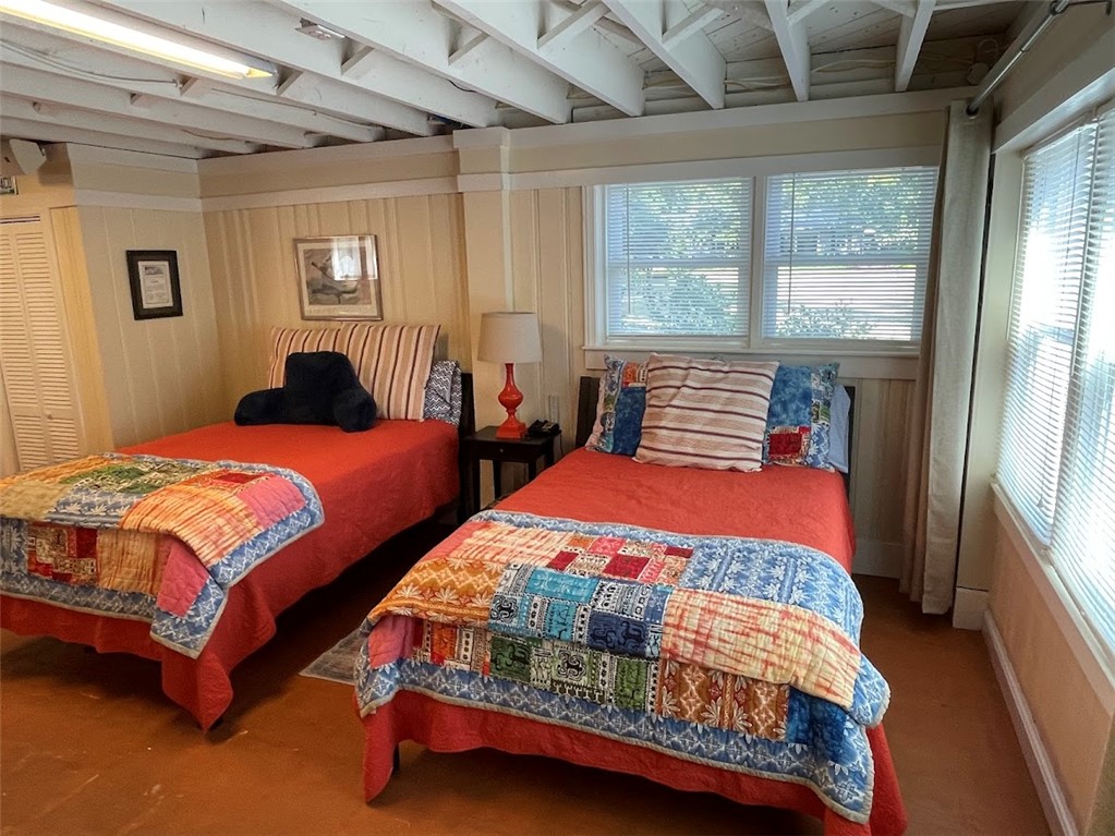 103 Poole Lane Clemson, SC 29631 - Photo 31 of 48 This cozy bedroom area of the basement features exposed beam ceilings and warm paneling, perfect for relaxation.