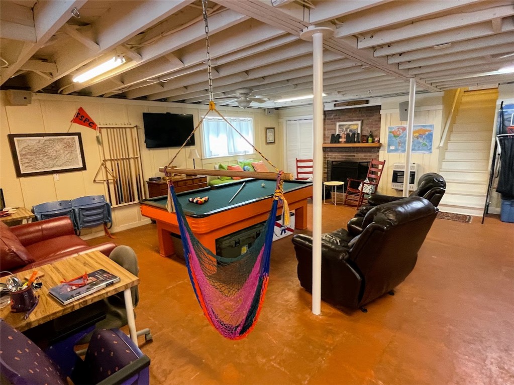103 Poole Lane Clemson, SC 29631 - Photo 34 of 48 This basement space features a wonderful wood burning fireplace and offers ample room for entertaining guests and hosting groups. There is a mini split HVAC that helps to maintain temps in this area.