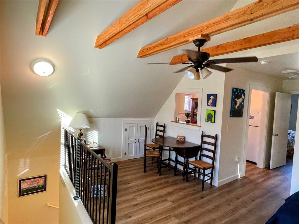 103 Poole Lane Clemson, SC 29631 - Photo 38 of 48 The apartment living area features sloped ceilings with exposed beams and durable LVT flooring.