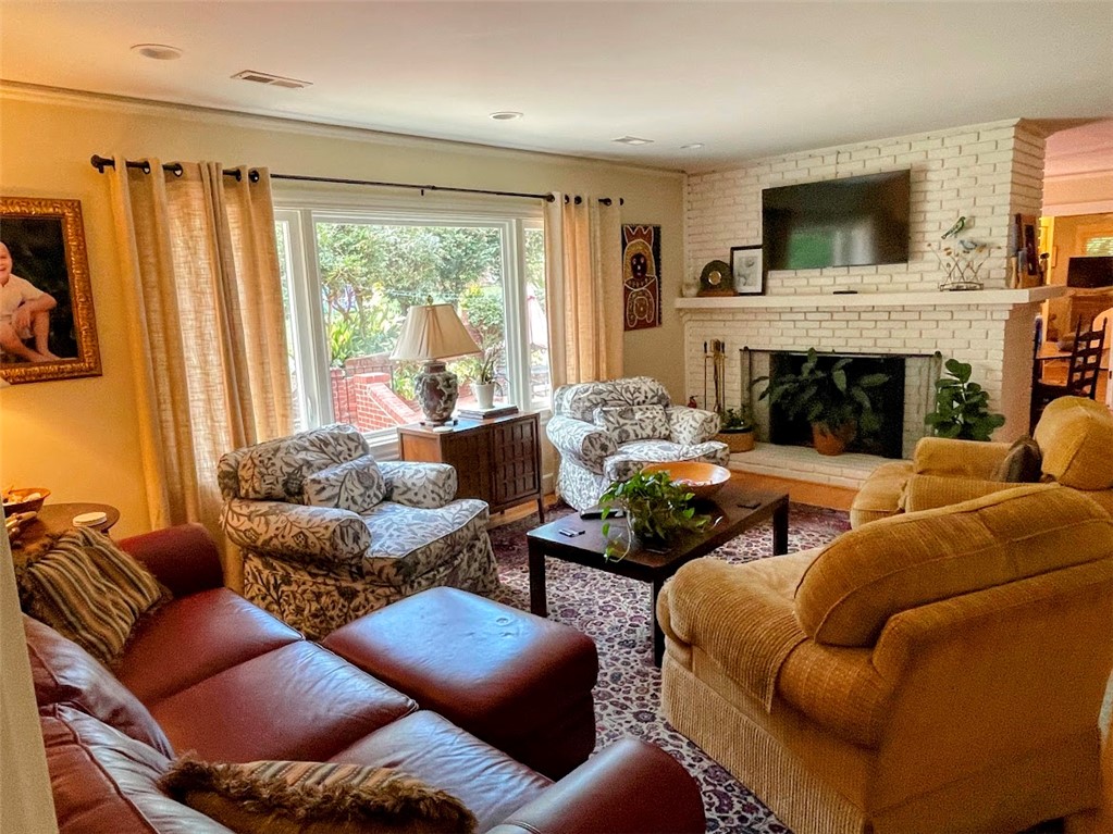 103 Poole Lane Clemson, SC 29631 - Photo 4 of 48 This inviting living room features a fireplace and offers a tranquil view of the outdoors.