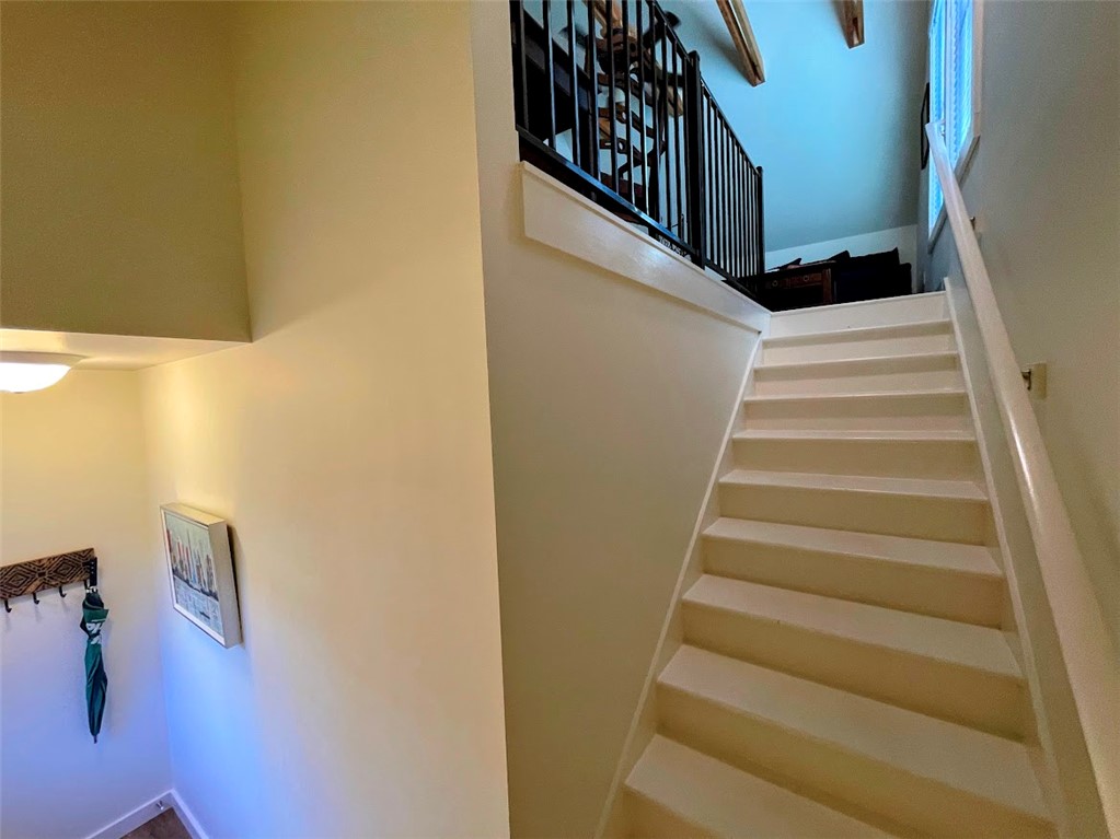 103 Poole Lane Clemson, SC 29631 - Photo 41 of 48 The private entry to the guest apartment is located on the side of the garage. It has a clean and well-lit staircase to the apartment.