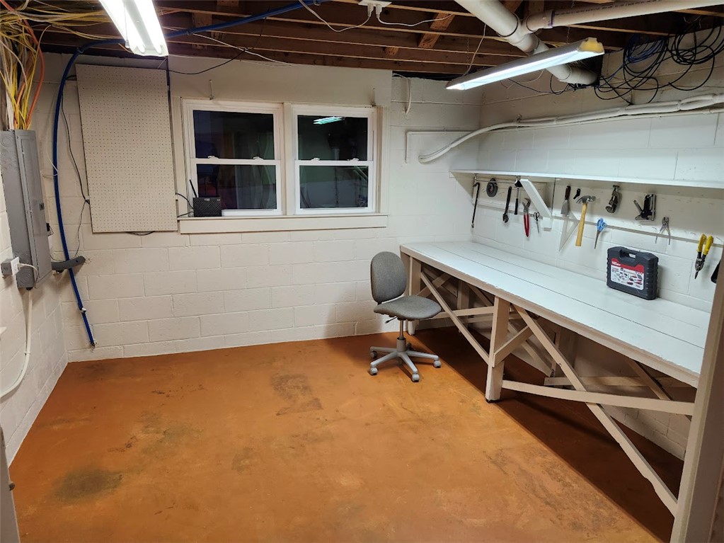 103 Poole Lane Clemson, SC 29631 - Photo 46 of 48 This spacious utility room offers a functional workbench and ample natural light, ideal for projects.
