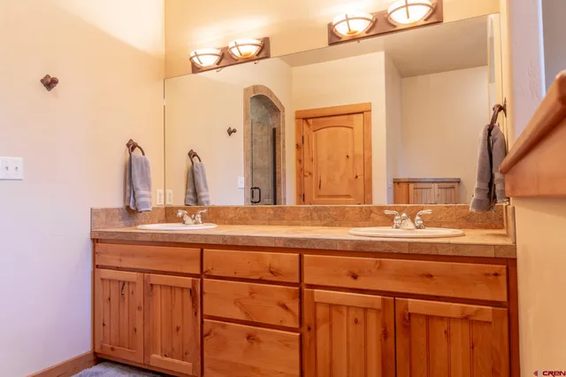 a bathroom with a sink and a mirror