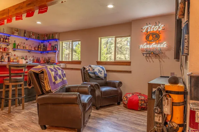 a bedroom with furniture and a chandelier