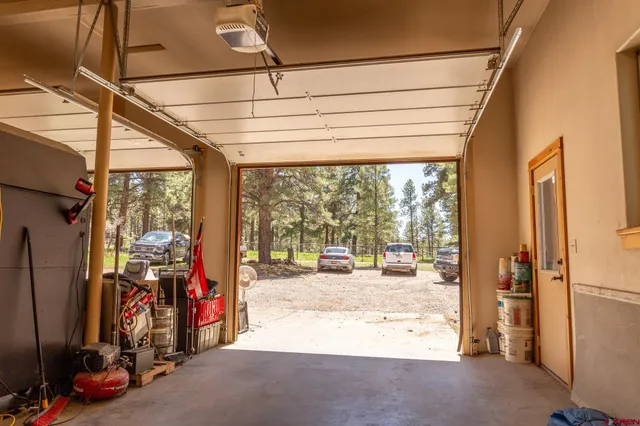 a view of a garage with the view of a living room