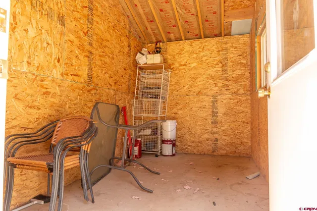 a backyard of a house with barbeque oven