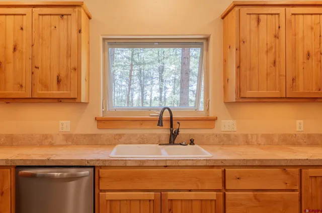 a kitchen with a sink and cabinets