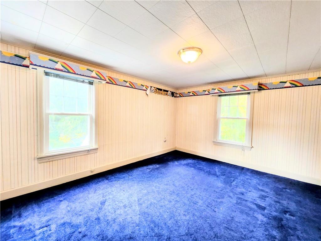 499 White School Road Greensburg, PA 15601 - Photo 19 of 38 a view of a room with wooden walls and a window