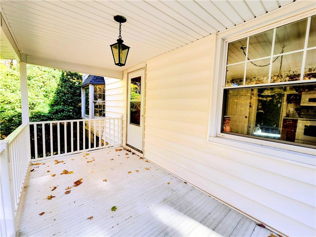 499 White School Road Greensburg, PA 15601 - Photo 29 of 38 a view of a porch with a table and chairs