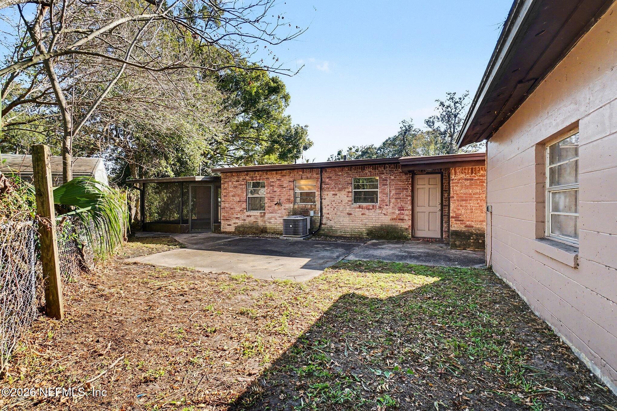 3661 Calla Drive Jacksonville, FL 32207 - Photo 13 of 16 a view of a house with a yard covered in snow