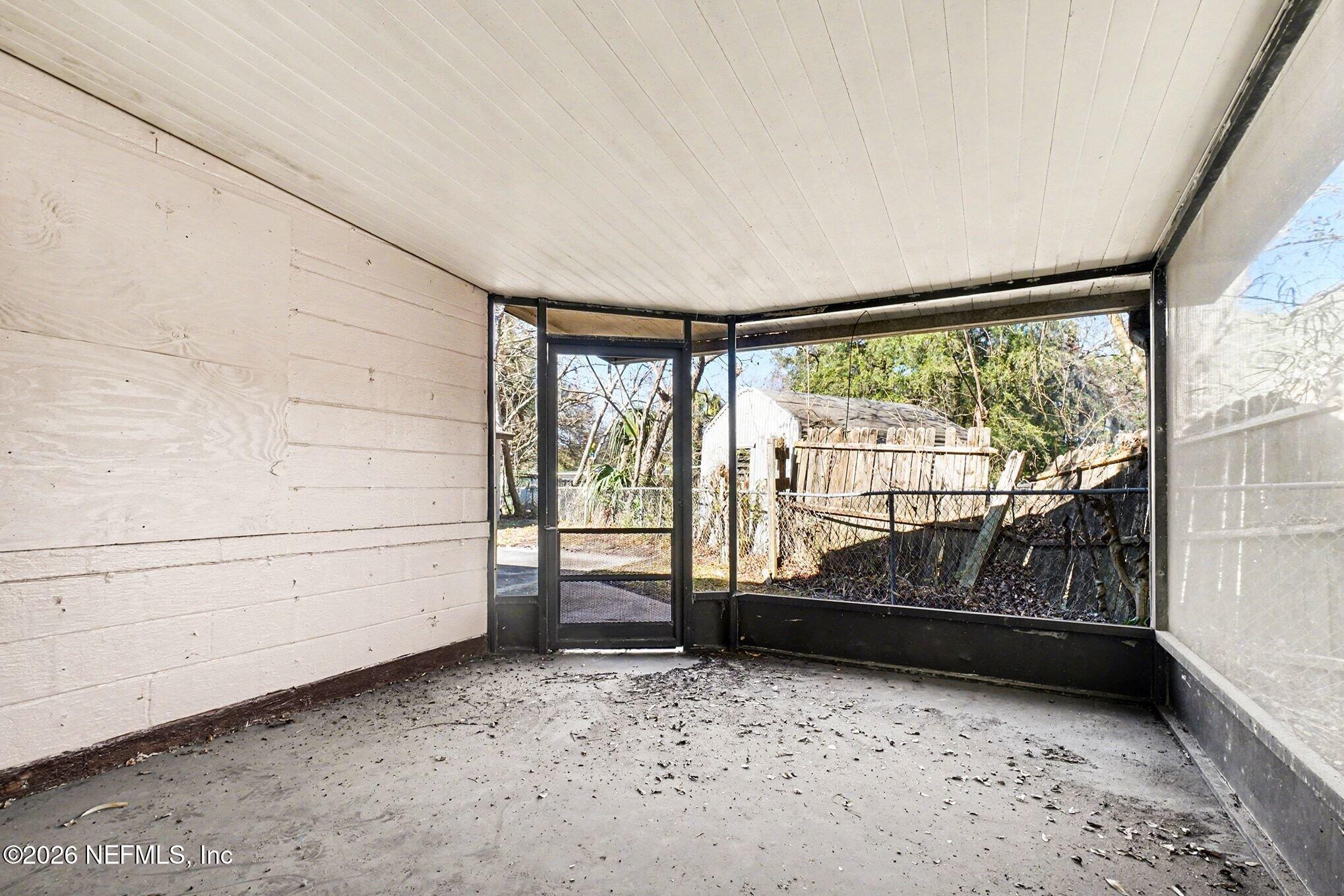 3661 Calla Drive Jacksonville, FL 32207 - Photo 14 of 16 a bedroom with a bed and a window