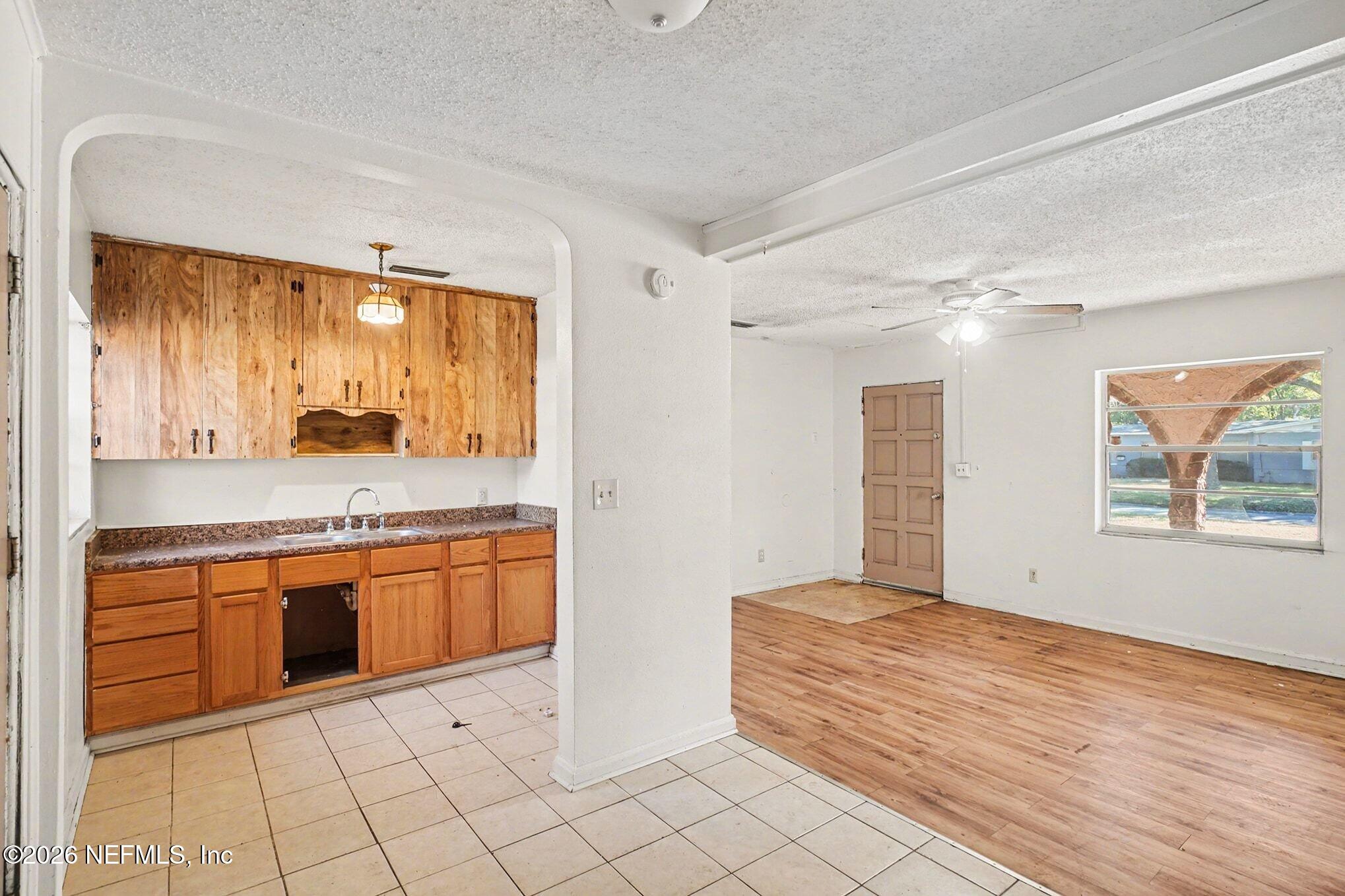 3661 Calla Drive Jacksonville, FL 32207 - Photo 4 of 16 a large bathroom with a granite countertop sink and a large mirror
