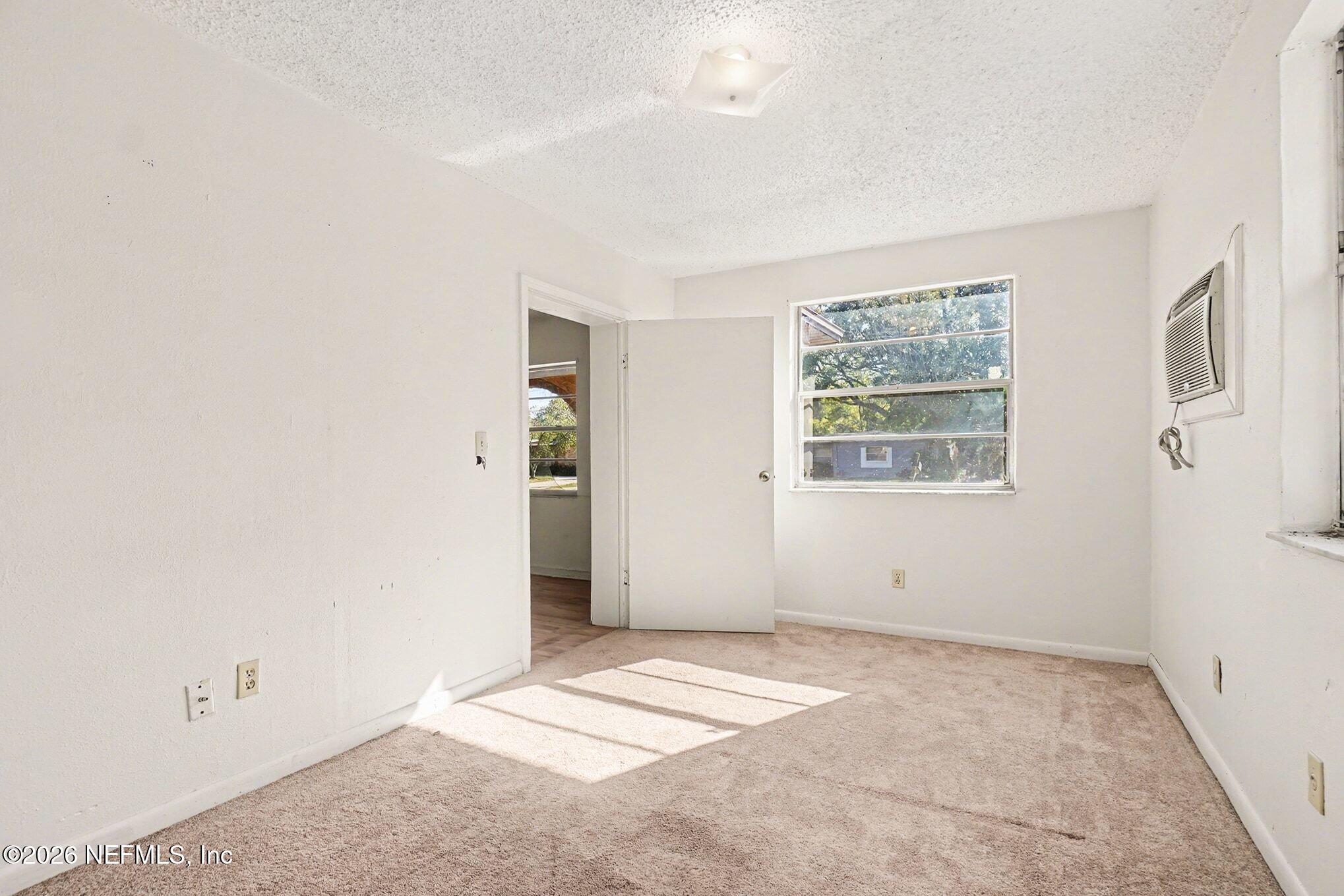 3661 Calla Drive Jacksonville, FL 32207 - Photo 6 of 16 an empty room with windows