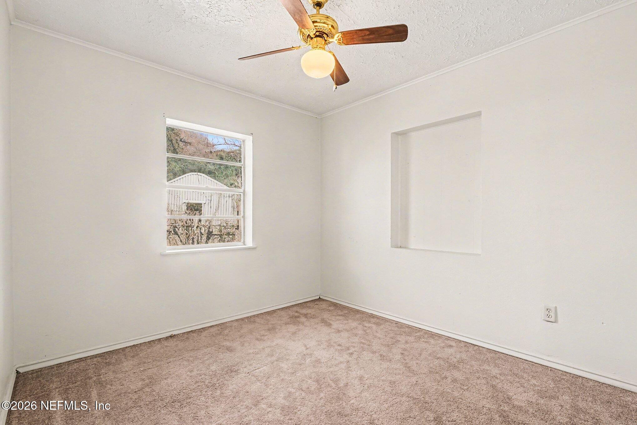 3661 Calla Drive Jacksonville, FL 32207 - Photo 9 of 16 a view of an empty room with a window
