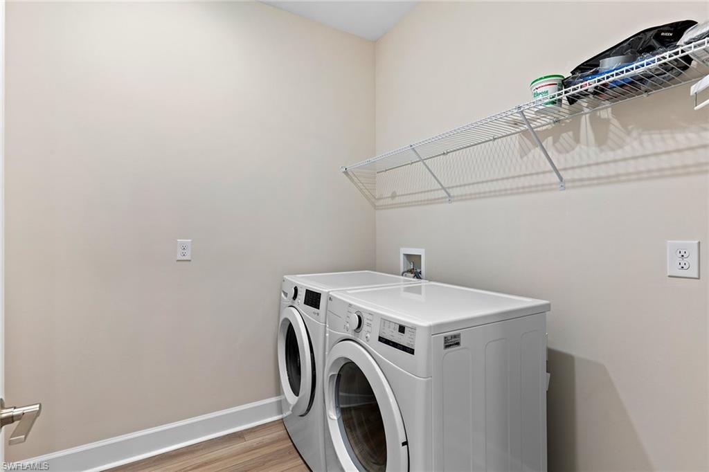 15657 Gavello Street Naples, FL 34114 - Photo 26 of 37 a utility room with dryer and washer