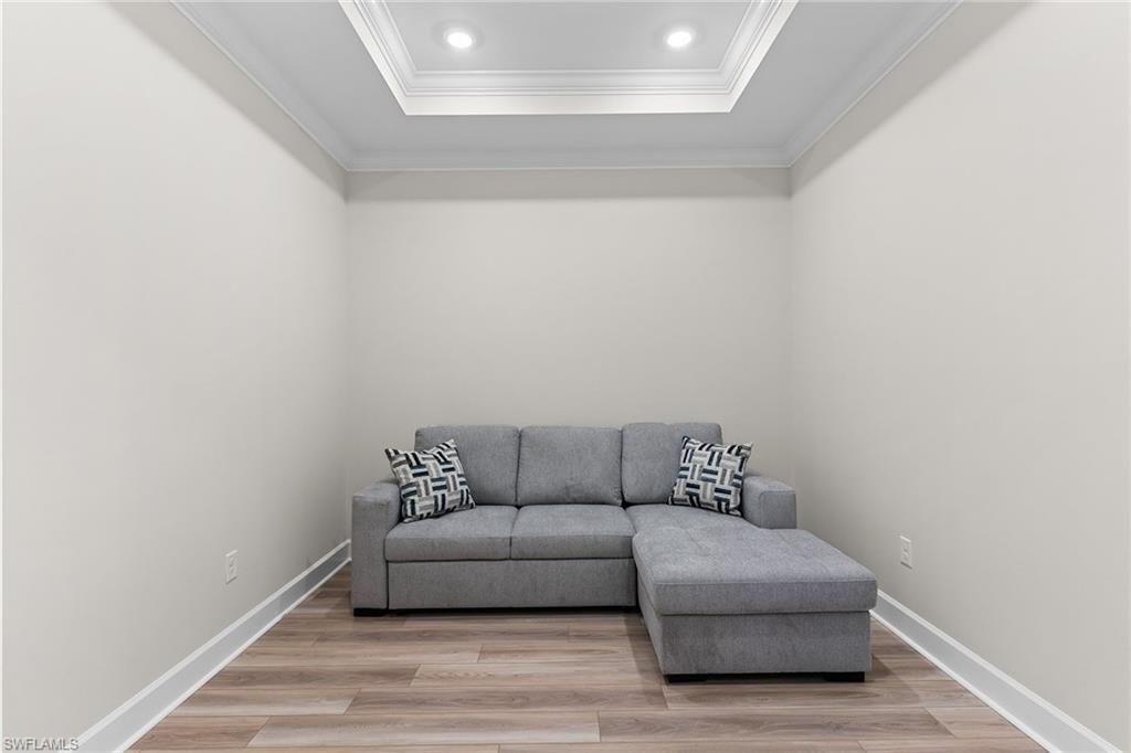 15657 Gavello Street Naples, FL 34114 - Photo 7 of 37 a living room with furniture and a couch