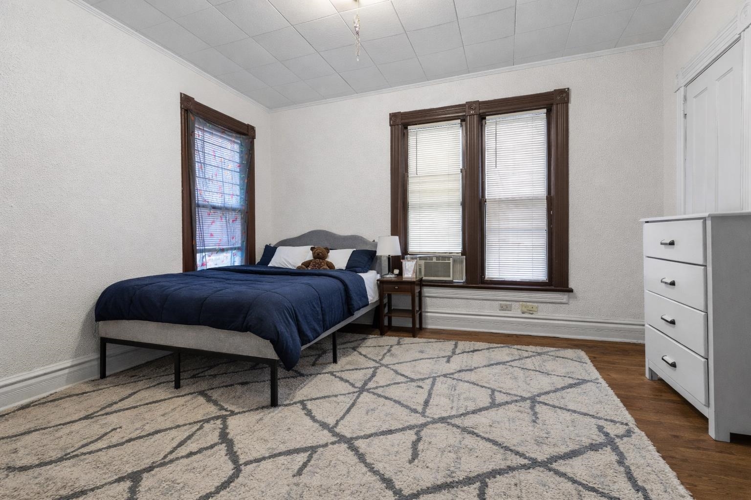 219 Rome Avenue Rockford, IL 61107 - Photo 13 of 24 a bedroom with a bed and a window