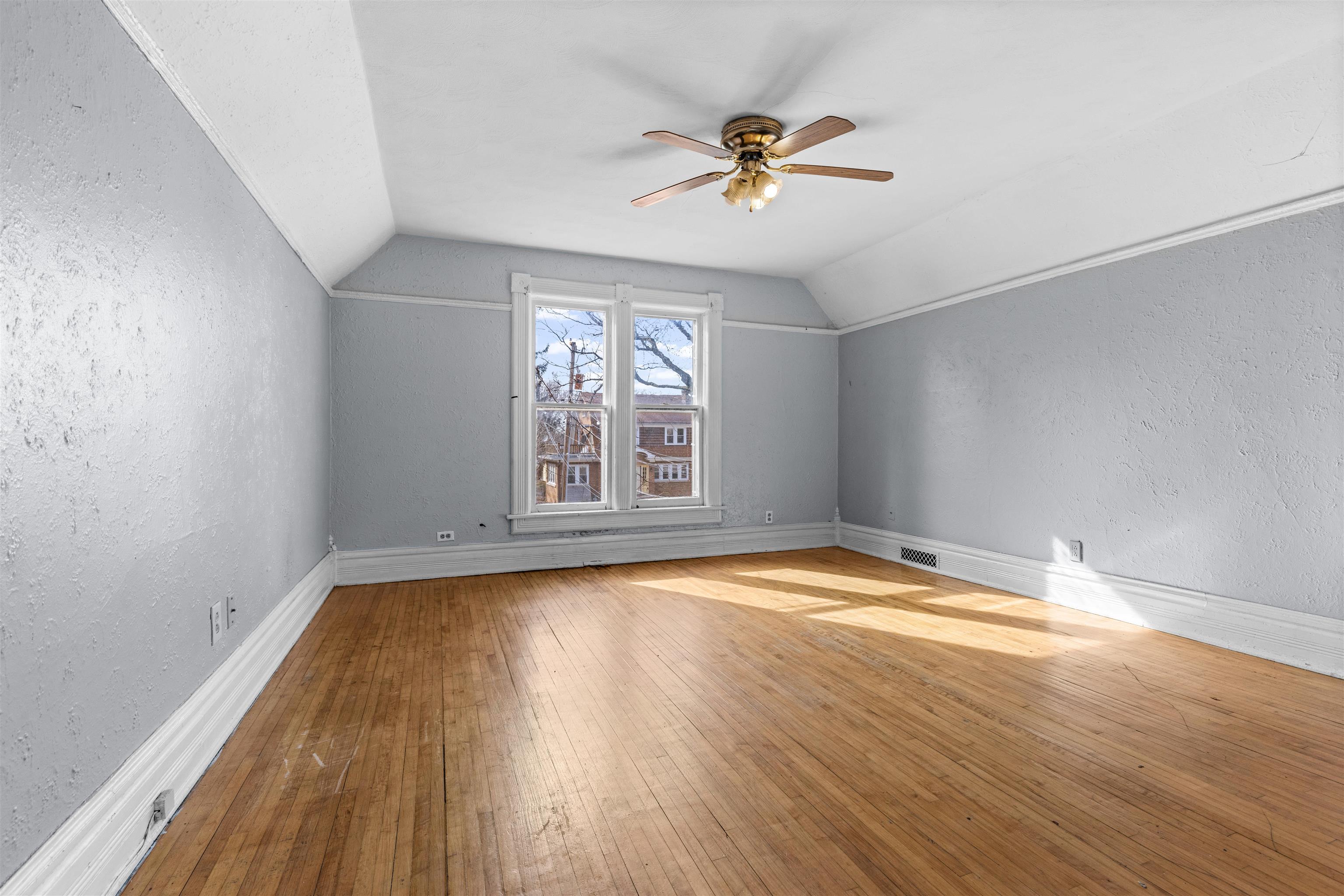 219 Rome Avenue Rockford, IL 61107 - Photo 15 of 24 a view of empty room with wooden floor and fan