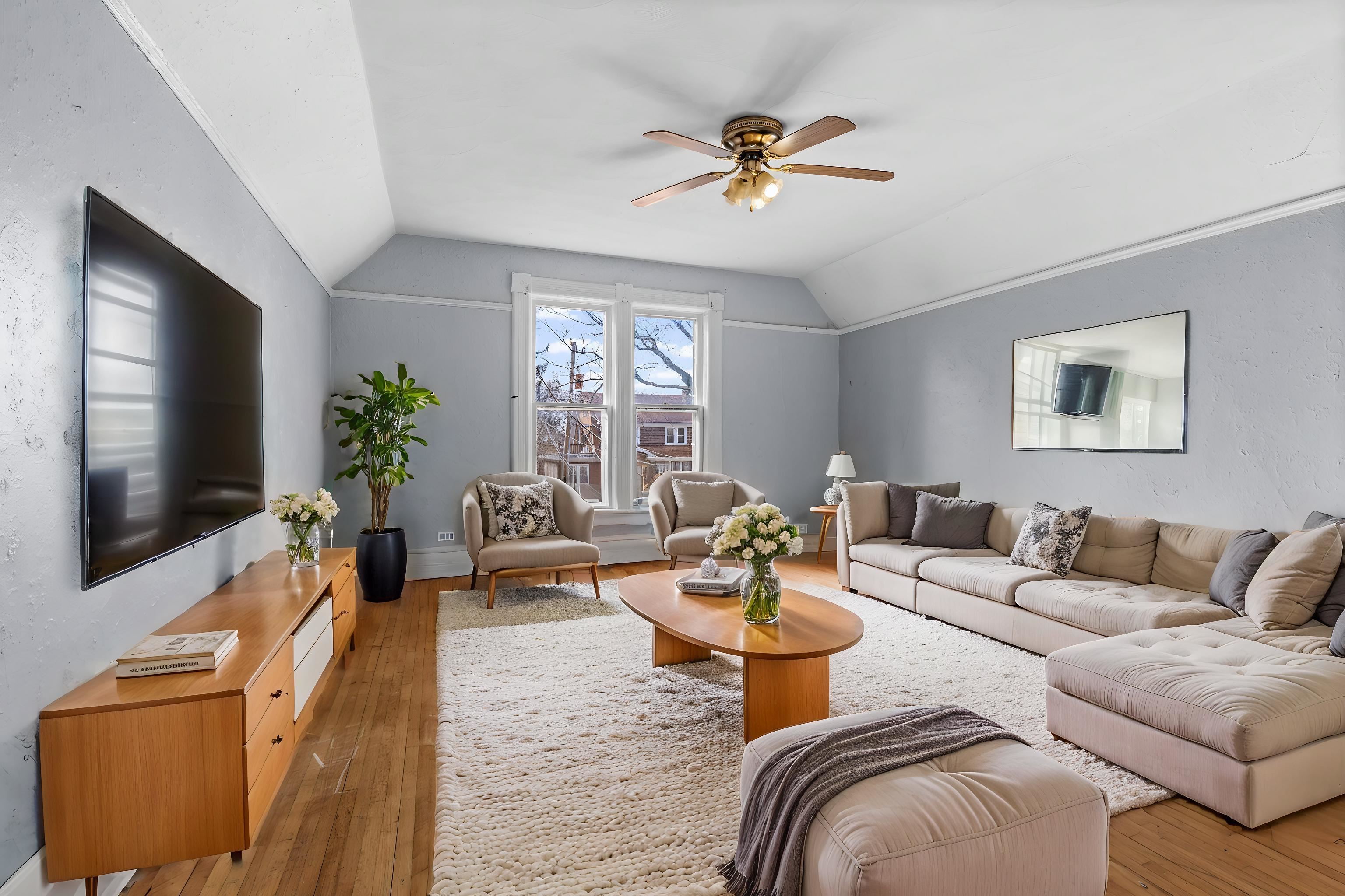 219 Rome Avenue Rockford, IL 61107 - Photo 16 of 24 a living room with furniture and a flat screen tv