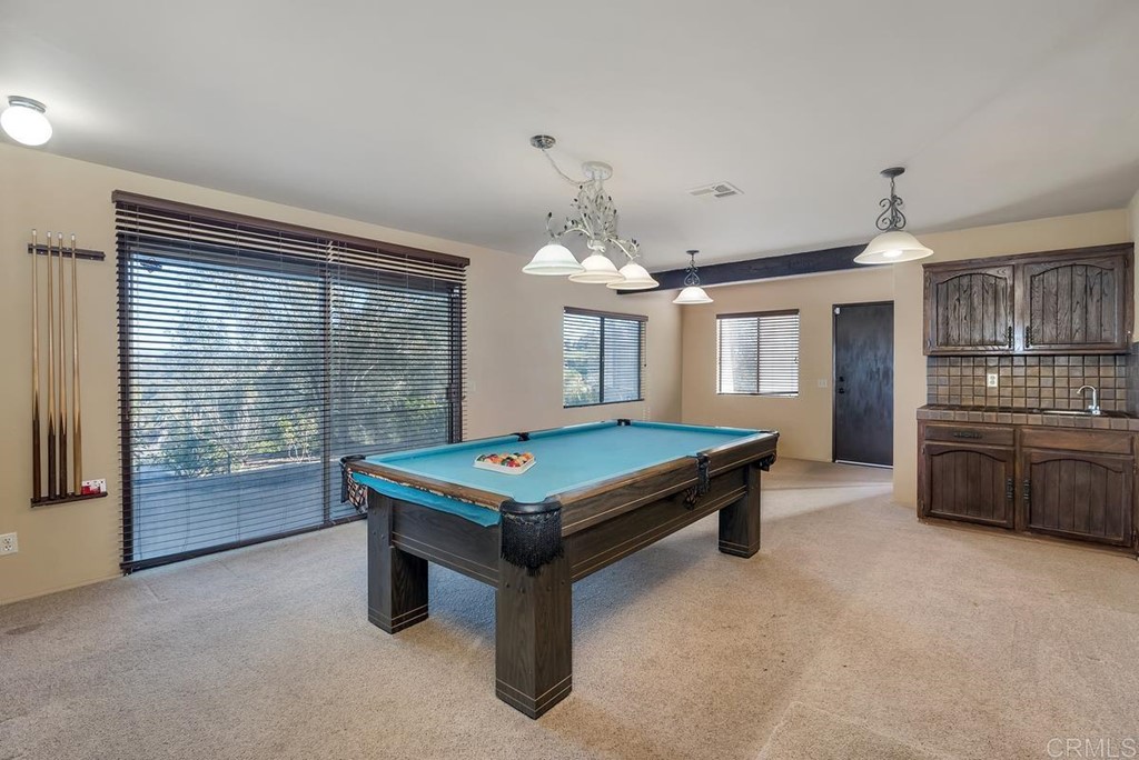 2527 Olive Hill Lane Fallbrook, CA 92028 - Photo 8 of 12 a room with pool table and windows