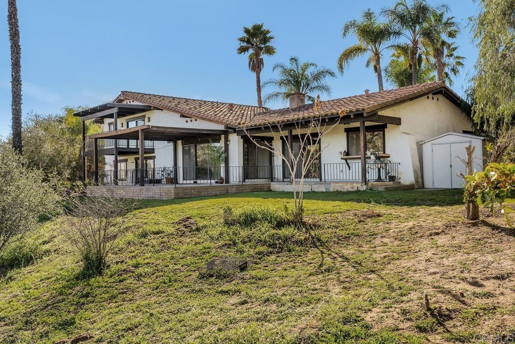 2527 Olive Hill Lane Fallbrook, CA 92028 - Photo 10 of 12 a front view of a house with a yard