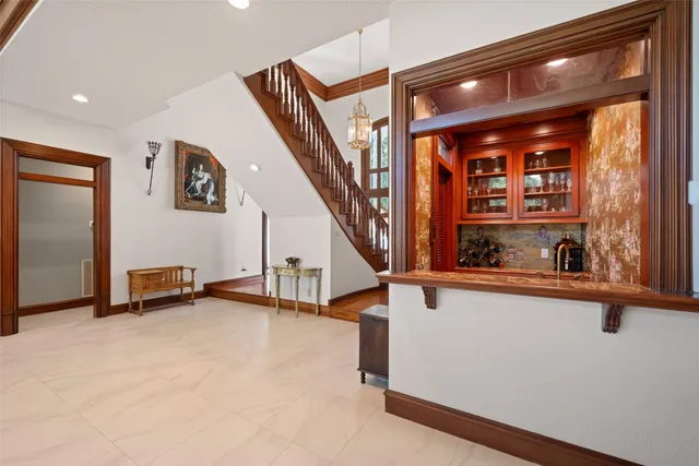 a view of a hallway with stairs