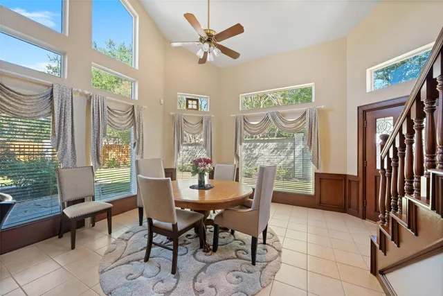 a dining room with furniture and window