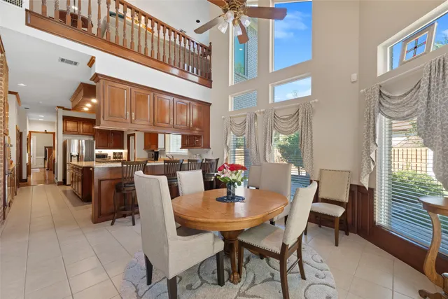 a view of a dining room with furniture and a window