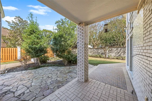 a view of a back yard from a patio