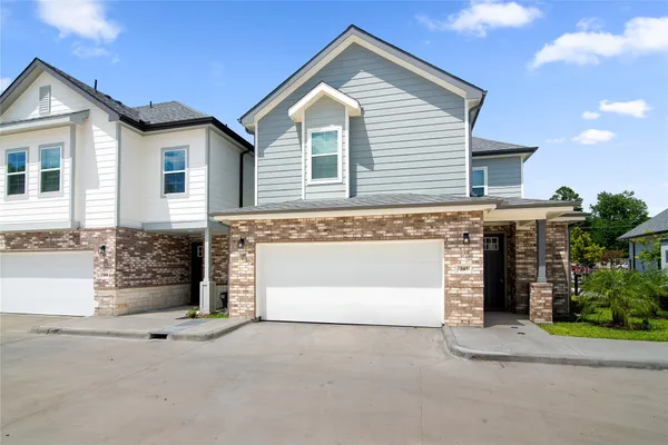 a front view of a house with a garage