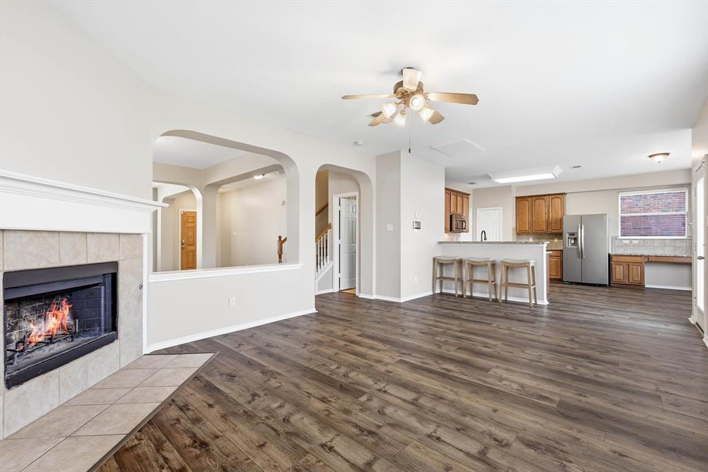 5229 Westheimer Road Fort Worth, TX 76244 - Photo 13 of 39 a living room with furniture and a fireplace