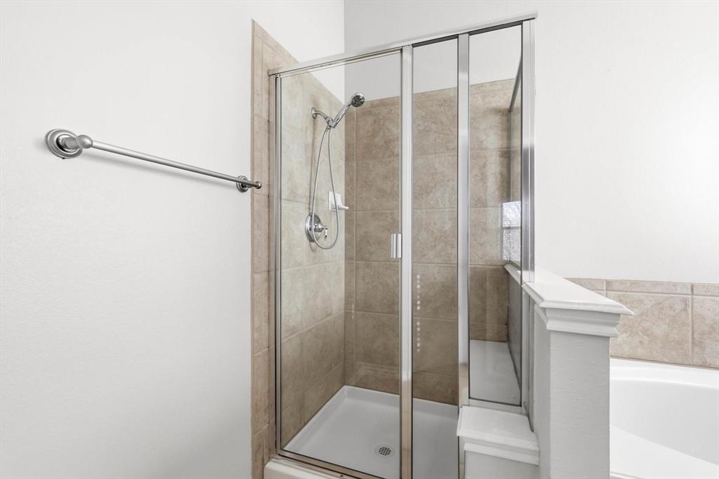 5229 Westheimer Road Fort Worth, TX 76244 - Photo 27 of 39 a bathroom with a shower and a sink