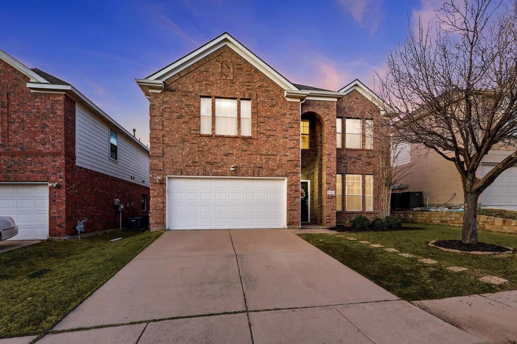 5229 Westheimer Road Fort Worth, TX 76244 - Photo 38 of 39 a front view of a house with a yard and garage