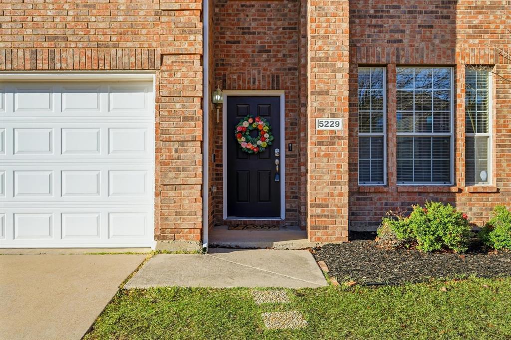 5229 Westheimer Road Fort Worth, TX 76244 - Photo 4 of 39 a front view of a house with a garden