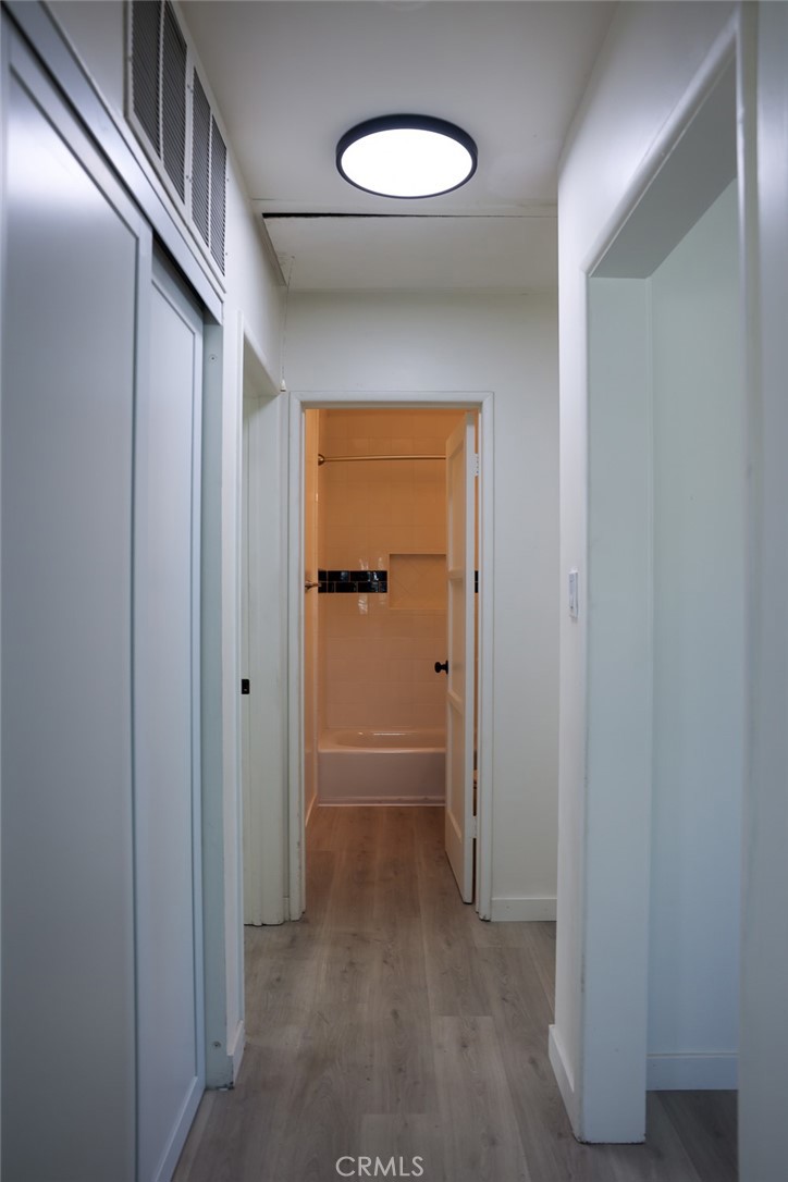 11253 Segrell Way Culver City, CA 90230 - Photo 14 of 17 a view of a hallway with wooden floor