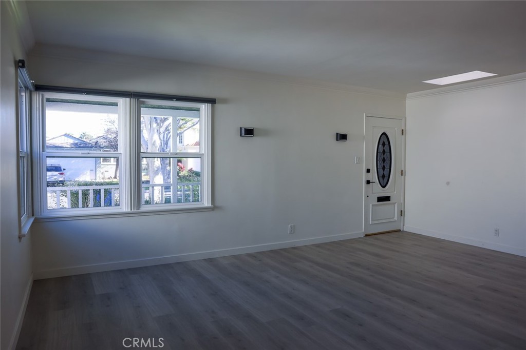 11253 Segrell Way Culver City, CA 90230 - Photo 2 of 17 a view of an empty room with wooden floor and a window