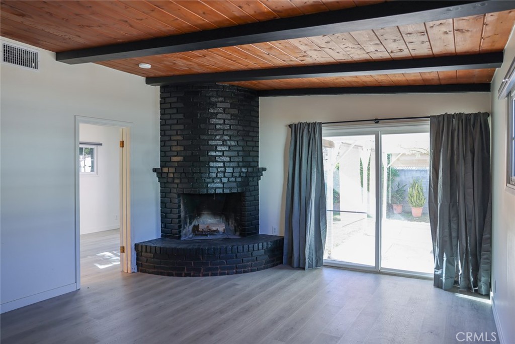 11253 Segrell Way Culver City, CA 90230 - Photo 8 of 17 a living room with furniture and a fireplace