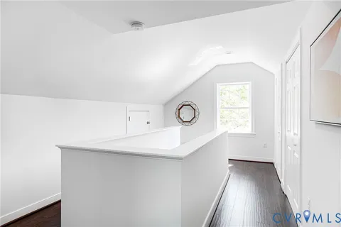 a view of a hallway with a kitchen