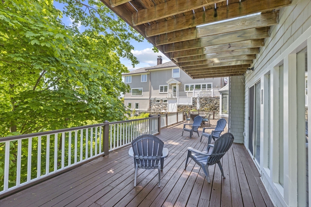 81 Ocean View Road Swampscott, MA 01907 - Photo 14 of 38 a view of a chairs and table on the wooden floor
