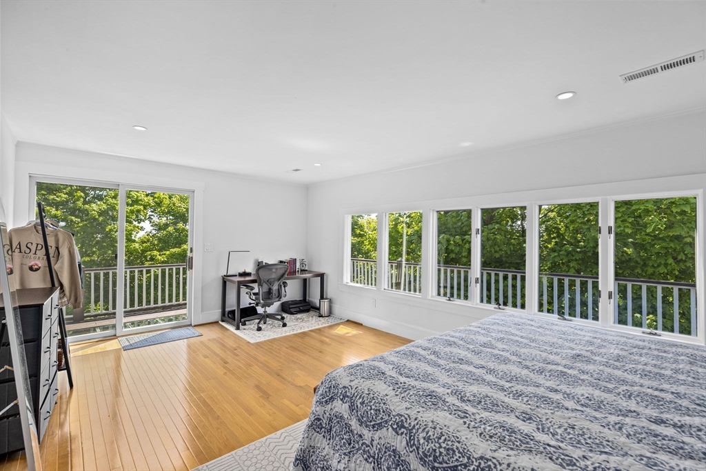 81 Ocean View Road Swampscott, MA 01907 - Photo 17 of 38 a bed sitting in a spacious bedroom next to a large window