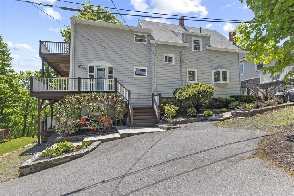 81 Ocean View Road Swampscott, MA 01907 - Photo 2 of 38 a front view of a house with a garden