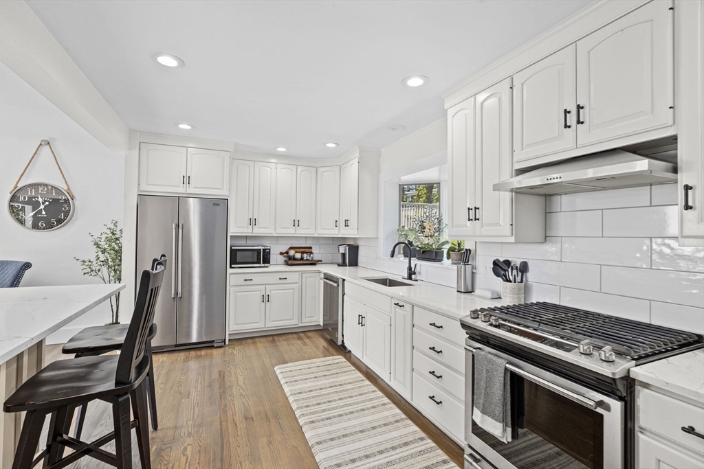 81 Ocean View Road Swampscott, MA 01907 - Photo 3 of 38 a kitchen with white cabinets and appliances