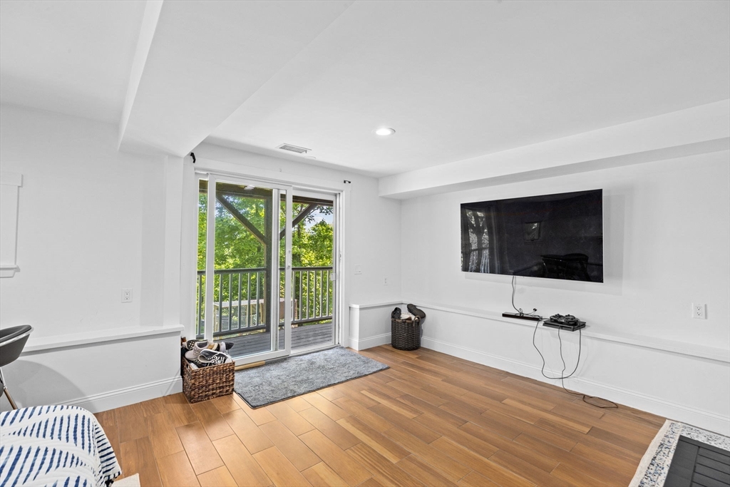 81 Ocean View Road Swampscott, MA 01907 - Photo 34 of 38 a bedroom with a bed and a flat screen tv