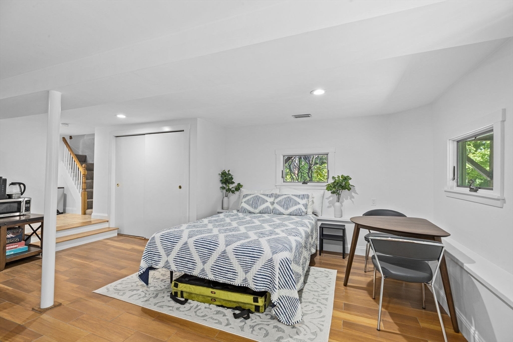 81 Ocean View Road Swampscott, MA 01907 - Photo 35 of 38 a bedroom with furniture and a wooden floor