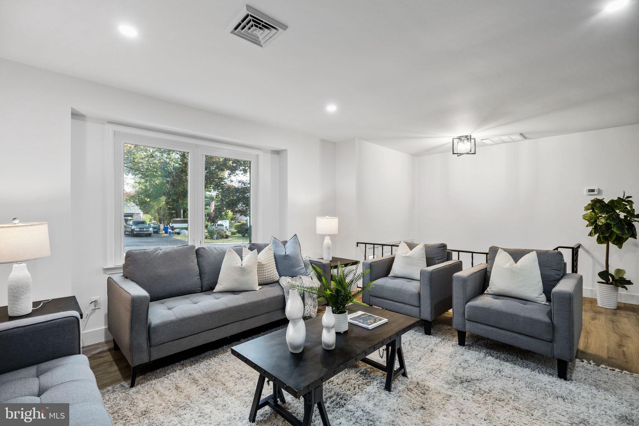 1189 Foxview Road Pottstown, PA 19465 - Photo 12 of 58 a living room with furniture and a large window