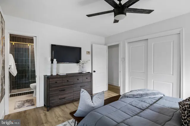 a living room with couches and a flat screen tv