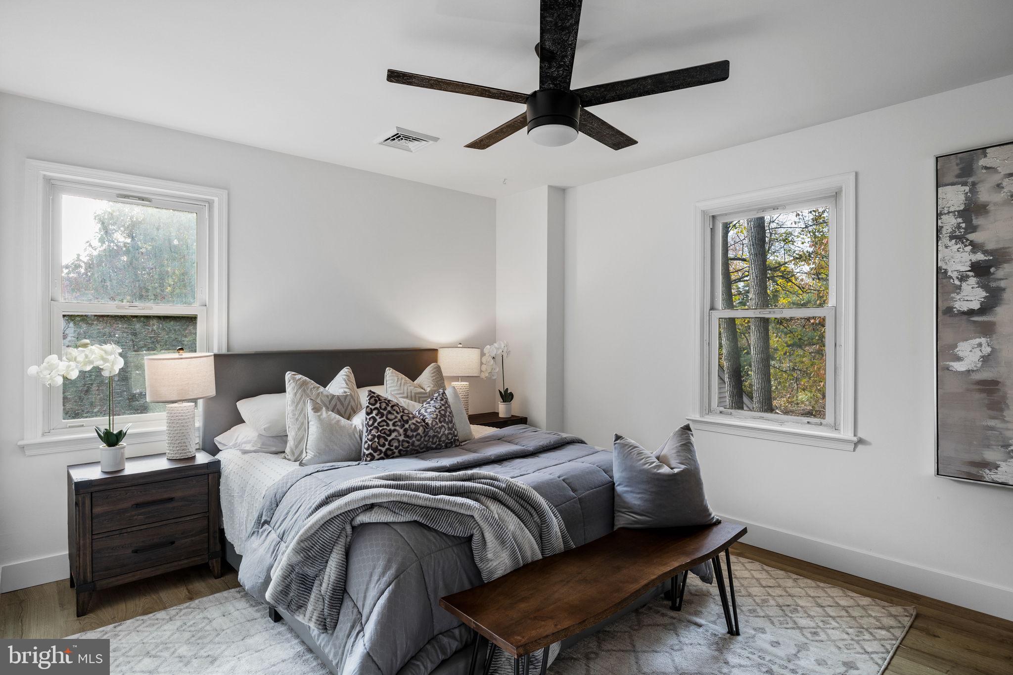 1189 Foxview Road Pottstown, PA 19465 - Photo 33 of 58 a bedroom with a bed and wooden floor
