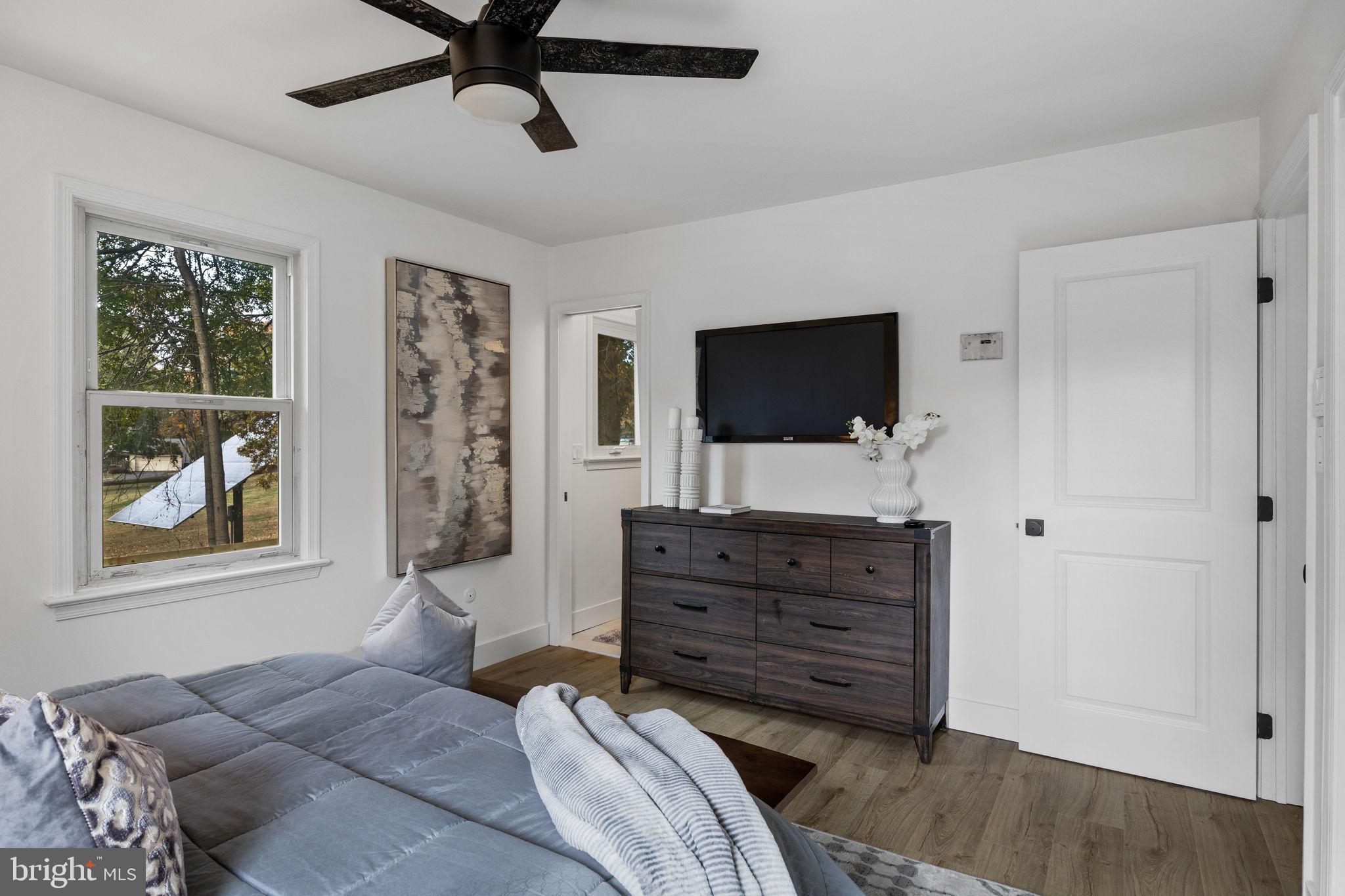 1189 Foxview Road Pottstown, PA 19465 - Photo 34 of 58 a living room with couches and a flat screen tv